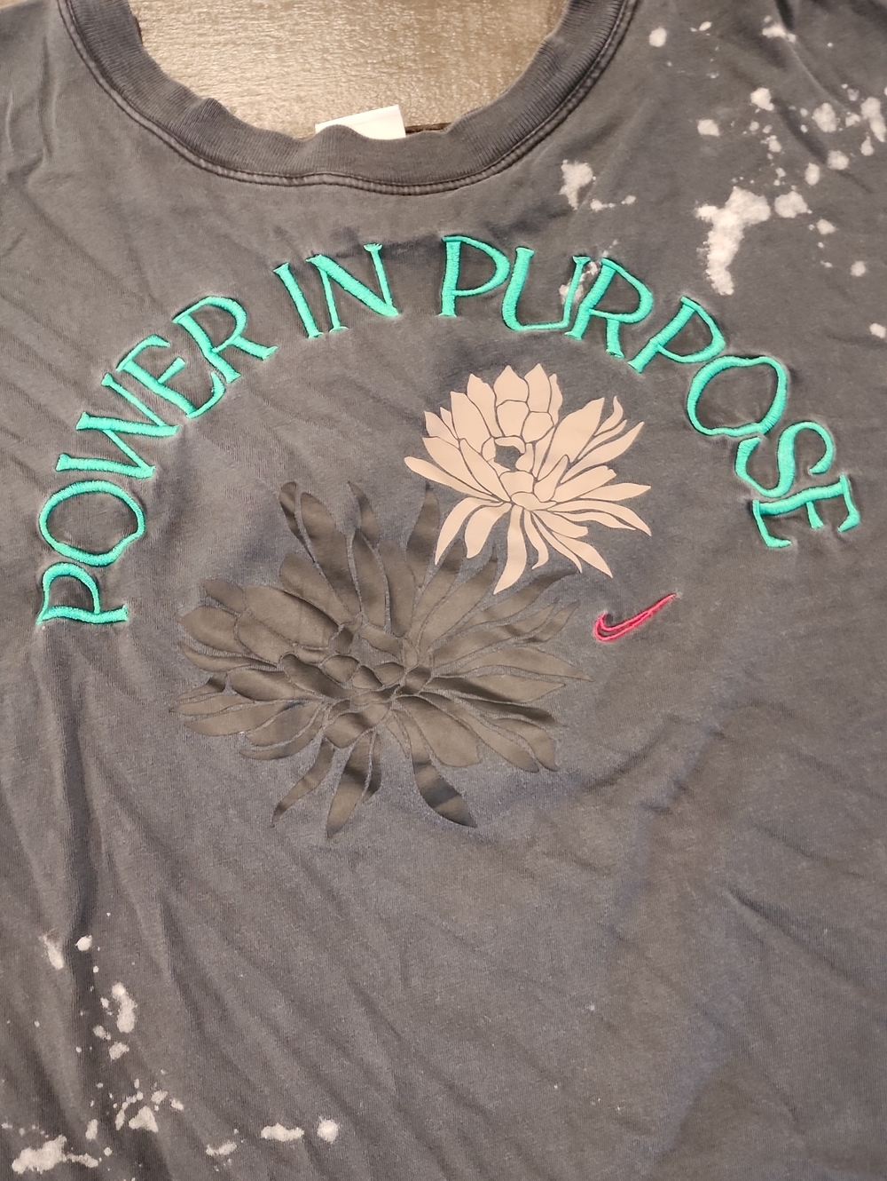 Nike Black Cropped Tee with Teal "Power in Purpose" Graphic